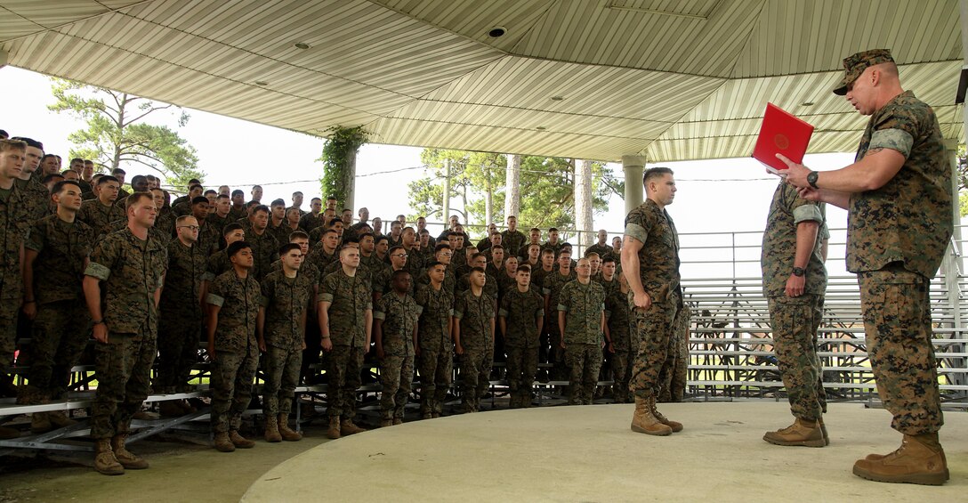 Sergeant Joseph Lamberty, an artilleryman assigned to Battery E, Battalion Landing Team 2/6, 26th Marine Expeditionary Unit, was presented a Navy and Marine Corps Achievement Medal by Maj. Gen. W. Lee Miller Jr, the II Marine Expeditionary Force commanding general, June 16. Lamberty was awarded as the II Marine Expeditionary Unit Noncommissioned Officer of the Year following an eight month deployment with the 26th MEU. Lamberty was part of a detachment of Marines deployed to Iraq in support of Operation Inherent Resolve as part of Task Force Spartan, where the unit provided indirect fire support to Iraqi security forces. (U.S. Marine Corps photo by Staff Sgt. Bobby J. Yarbrough/Released) 
