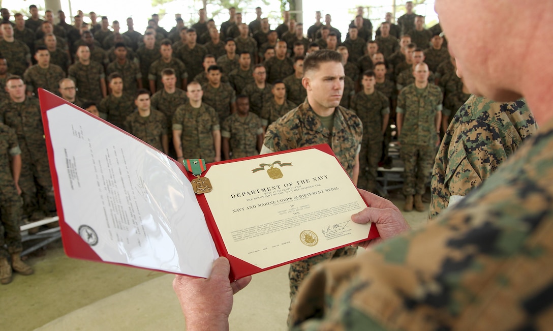 Sergeant Joseph Lamberty, an artilleryman assigned to Battery E, Battalion Landing Team 2/6, 26th Marine Expeditionary Unit, was presented a Navy and Marine Corps Achievement Medal by Maj. Gen. W. Lee Miller Jr, the II Marine Expeditionary Force commanding general, June 16. Lamberty was awarded as the II Marine Expeditionary Unit Noncommissioned Officer of the Year following an eight month deployment with the 26th MEU. Lamberty was part of a detachment of Marines deployed to Iraq in support of Operation Inherent Resolve as part of Task Force Spartan, where the unit provided indirect fire support to Iraqi security forces. (U.S. Marine Corps photo by Staff Sgt. Bobby J. Yarbrough/Released) 