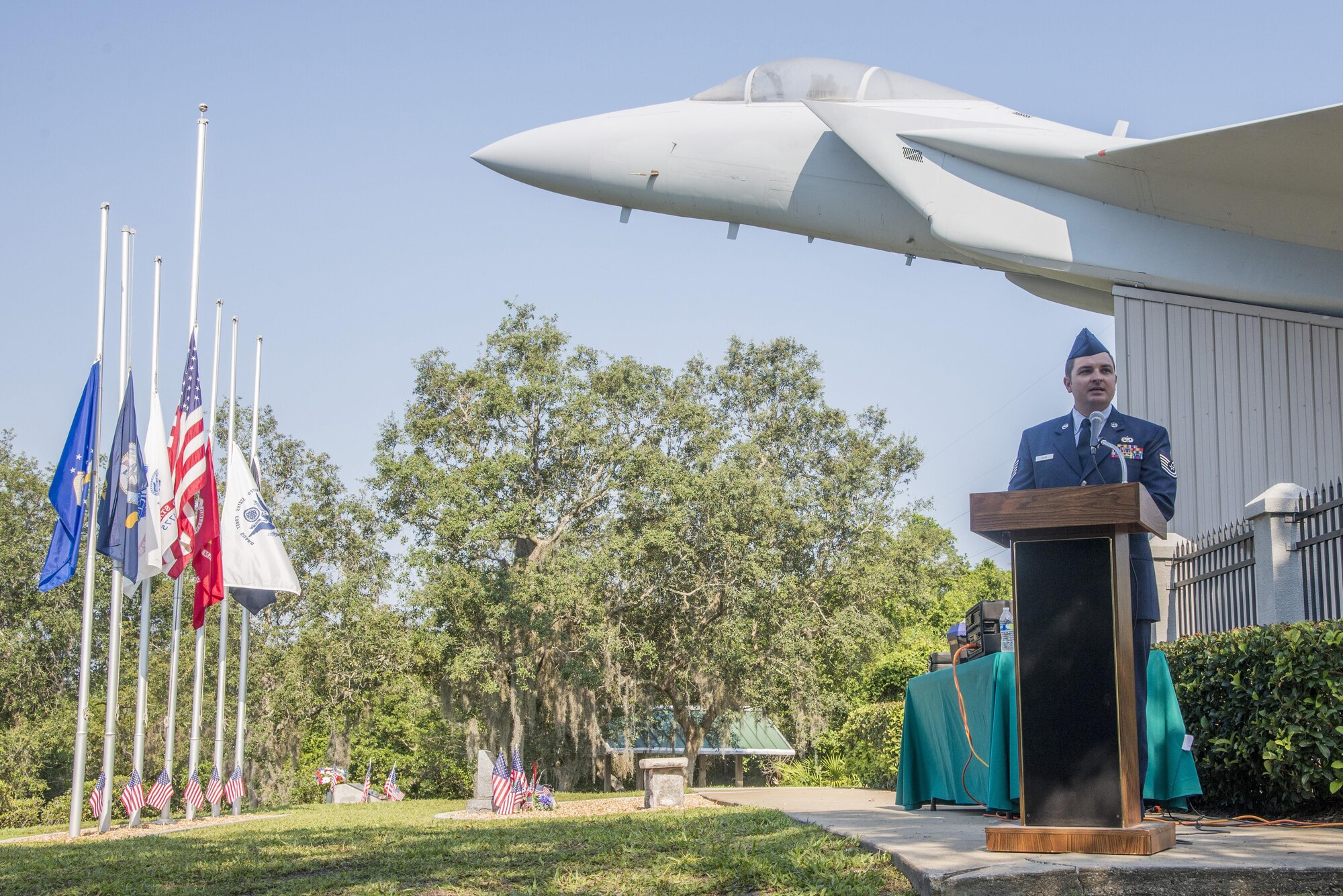 Tech. Sgt. Jody Mann, 33rd Aircraft Maintenance Squadron crew chief, speaks at an aircraft rededication ceremony June 14, 2016, at Memorial Park in DeBary Fla. The aircraft was rededicated in memory of Airman 1st Class Brian McVeigh, a member of the 33rd Fighter Wing, who was killed in the Khobar Towers terrorist attack in 1996. (U.S. Air Force photo by Senior Airman Stormy Archer/Released)