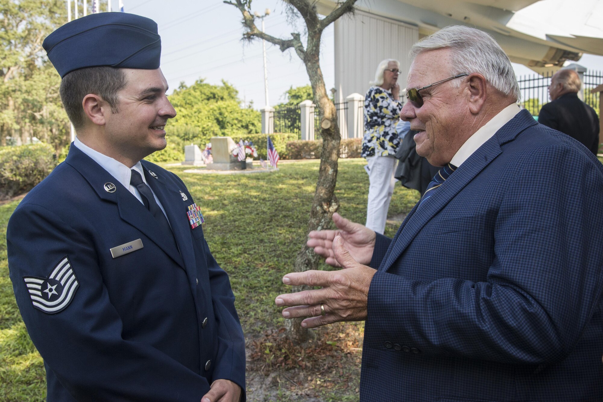 Tech. Sgt. Jody Mann, 33rd Aircraft Maintenance Squadron crew chief, speaks to James Wetmore, step father of Airman 1st Class Brian McVeigh, at an aircraft rededication ceremony June 14, 2016, at Memorial Park in DeBary Fla. McVeigh was a member of the 33rd Fighter Wing and native of Debary who was killed in the Khobar Towers terrorist attack in 1996. (U.S. Air Force photo by Senior Airman Stormy Archer/Released)