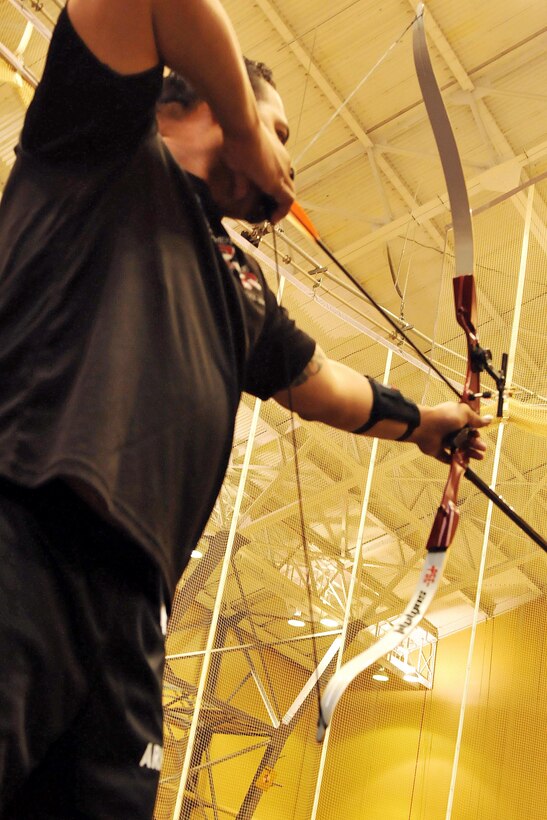 U.S. Army Veteran David Iuli takes a steady aim during Team Army archery training in preparation for the 2016 Department of Defense Warrior Games held at the United States Military Academy at West Point, New York, June 13. The DoD Warrior Games, June 15-21, is an adaptive sports competition for wounded, ill and injured service members and Veterans. Athletes representing teams from the Army, Marine Corps, Navy, Air Force, Special Operations Command and the United Kingdom Armed Forces compete in archery, cycling, track, field, shooting, sitting volleyball, swimming, and wheelchair basketball. (US Army photo by Master Sgt. D. Keith Johnson/Released)