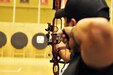 U.S. Army Veteran Staff Sgt. Eric Pardo takes aim during Team Army archery training in preparation for the 2016 Department of Defense Warrior Games held at the United States Military Academy at West point, New York, June 13. The DoD Warrior Games, June 15-21, is an adaptive sports competition for wounded, ill and injured service members and Veterans. Athletes representing teams from the Army, Marine Corps, Navy, Air Force, Special Operations Command and the United Kingdom Armed Forces compete in archery, cycling, track, field, shooting, sitting volleyball, swimming, and wheelchair basketball. (US Army photo by Master Sgt. D. Keith Johnson/Released)