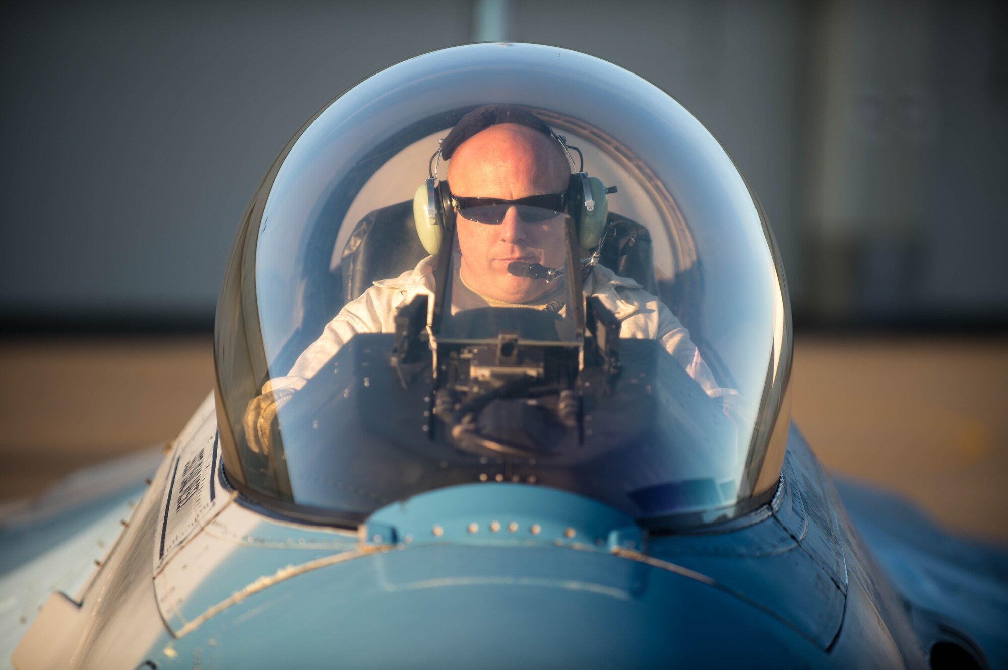 U.S. Air Force Staff Sgt. Theodore Lau, a 354th Aircraft Maintenance Squadron aerospace proposition technician, sits in the cockpit for a test run of an F-16 Fighting Falcon fighter aircraft while working the swing shift June 14, 2016, during RED FLAG-Alaska (RF-A) 16-2 at Eielson Air Force Base, Alaska. RF-A 16-2, the largest exercise of it’s kind in six years, simulates the first 10 combat sorties during the initial stages of war or a surge operation, which pushes pilots to fly jets built in the 80s to their limits, creating a 185 percent usage compared to normal flying operations. (U.S. Air Force photo by Staff Sgt. Shawn Nickel/Released)