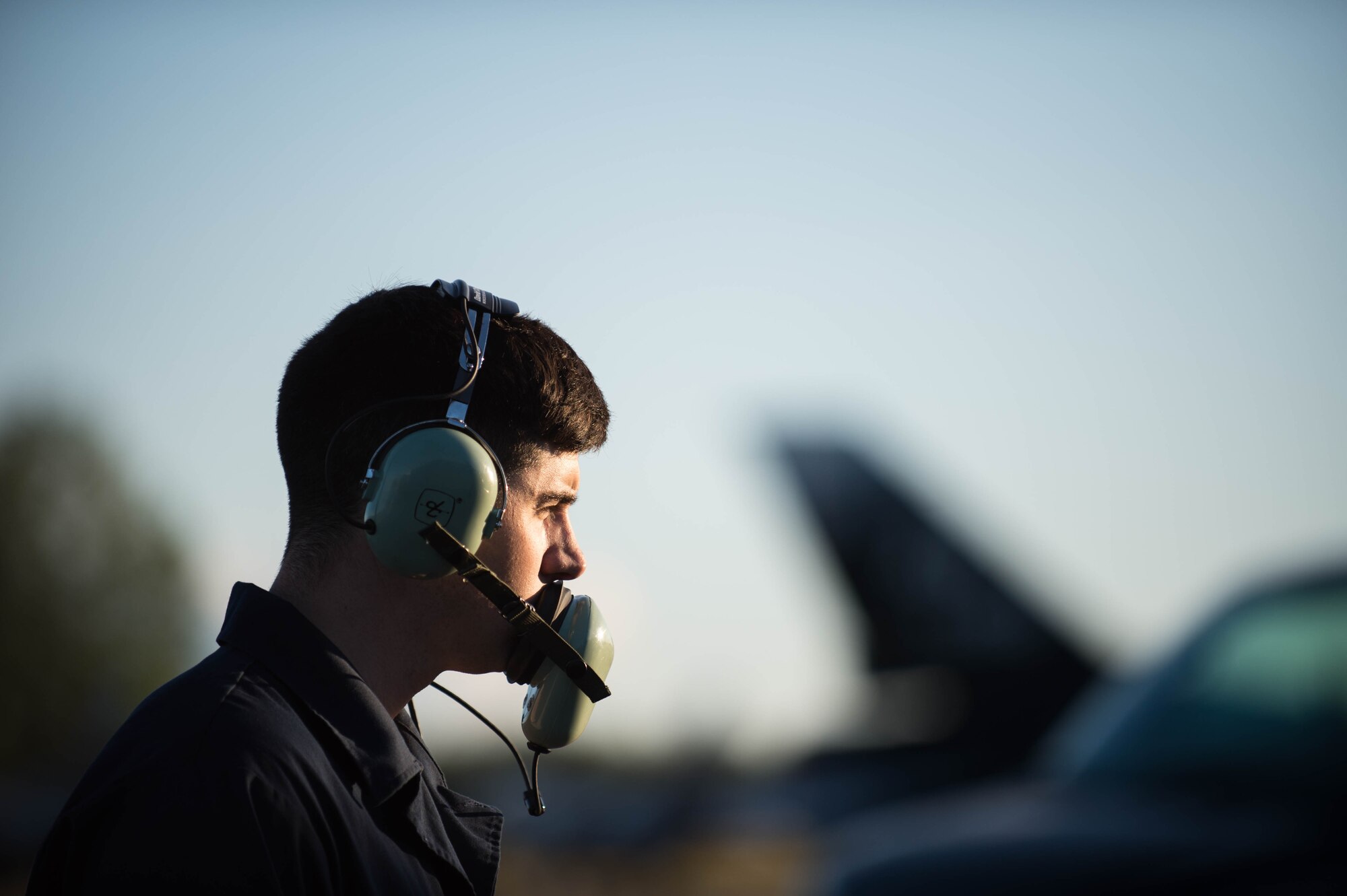 U.S. Air Force Senior Airman Brendan Tarbett, a 354th Aircraft Maintenance Squadron avionics technician, controls a test run on an F-16 Fighting Falcon fighter aircraft while working swing shift June 14, 2016, during RED FLAG-Alaska (RF-A) 16-2 at Eielson Air Force Base, Alaska. Jets are flown almost double the normal hours during RF-A, increasing the need for maintenance, which provides training for support personnel in sustainment of large-force deployed air operations. (U.S. Air Force photo by Staff Sgt. Shawn Nickel/Released)