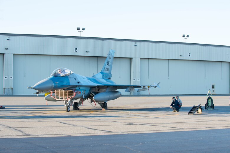 U.S. Airmen with the 354th Aircraft Maintenance Squadron test run an F-16 Fighting Falcon fighter aircraft while working swing shift June 14, 2016, during RED FLAG-Alaska (RF-A) 16-2 at Eielson Air Force Base, Alaska. Jets are flown almost double the normal hours during RF-A, increasing the need for maintenance by 85 percent, which provides training for support personnel in sustainment of large-force deployed air operations. (U.S. Air Force photo by Staff Sgt. Shawn Nickel/Released)