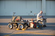 U.S. Air Force Staff Sgt. Theodore Lau, a 354th Aircraft Maintenance Squadron aerospace proposition technician, sits on his tool cart filling out continuity paperwork after the test run of an F-16 Fighting Falcon fighter aircraft while working swing shift June 14, 2016, during RED FLAG-Alaska (RF-A) 16-2 at Eielson Air Force Base, Alaska. RF-A 16-2, the largest exercise of it’s kind in six years, simulates the first 10 combat sorties during the initial stages of war or a surge operation, which pushes pilots to fly jets built in the 80s to their limits, creating a 185 percent usage compared to normal flying operations. (U.S. Air Force photo by Staff Sgt. Shawn Nickel/Released)
