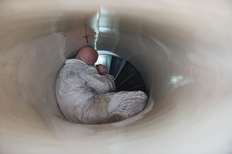 U.S. Air Force Staff Sgt. Theodore Lau, a 354th Aircraft Maintenance Squadron aerospace propulsion technician, inspects the intake of an F-16 Fighting Falcon fighter aircraft while working swing shift June 14, 2016, during RED FLAG-Alaska (RF-A) 16-2 at Eielson Air Force Base, Alaska. RF-A 16-2, the largest exercise of it’s kind in six years, simulates the first 10 combat sorties during the initial stages of war or a surge operation, providing training for support personnel in sustainment of large-force deployed air operations. (U.S. Air Force photo by Staff Sgt. Shawn Nickel/Released)

