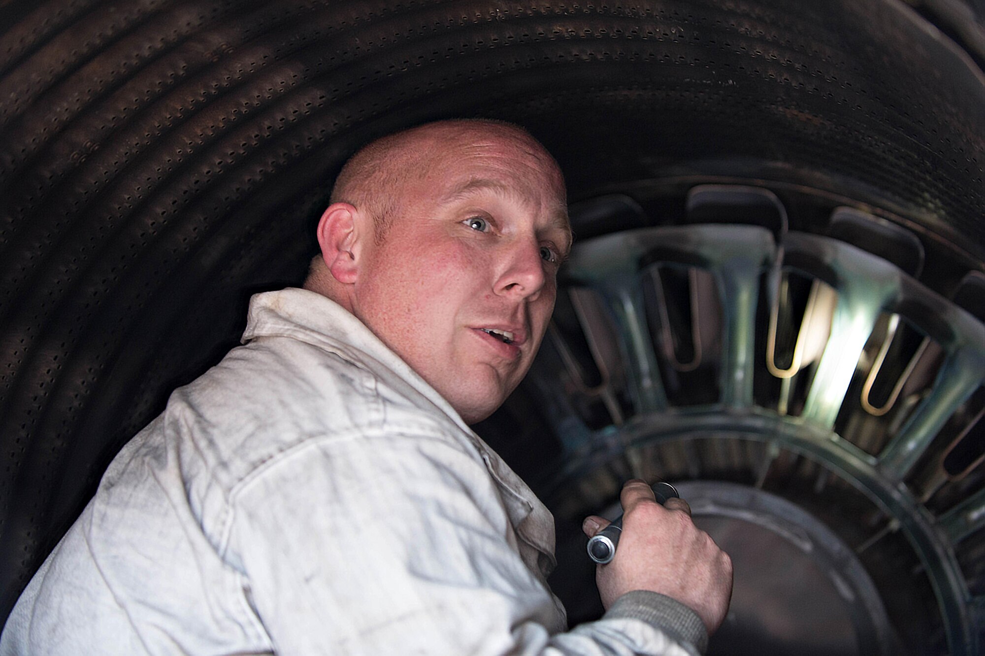 U.S. Air Force Staff Sgt. Theodore Lau, a 354th Aircraft Maintenance Squadron aerospace propulsion technician, inspects fins inside the exhaust of an F-16 Fighting Falcon fighter aircraft while working swing shift June 14, 2016, during RED FLAG-Alaska (RF-A) 16-2 at Eielson Air Force Base, Alaska. Jets are flown almost double the normal hours during RF-A, increasing the need for maintenance, which provides training for support personnel in sustainment of large-force deployed air operations. (U.S. Air Force photo by Staff Sgt. Shawn Nickel/Released)
