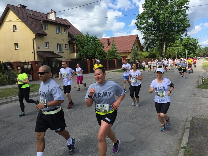 U.S. Army Reserve Soldiers with the 364th Expeditionary Sustainment Command, Marysville, Washington, participate in a 10-kilometer run through the Polish town Sulejowek during Anakonda 2016, June 11. Anakonda 16 is a Polish-led national event that seeks to train, exercise and integrate Polish national command and force structures into an Allied, joint, multinational environment. (Photo by Capt. A. Sean Taylor, 649th RSG)