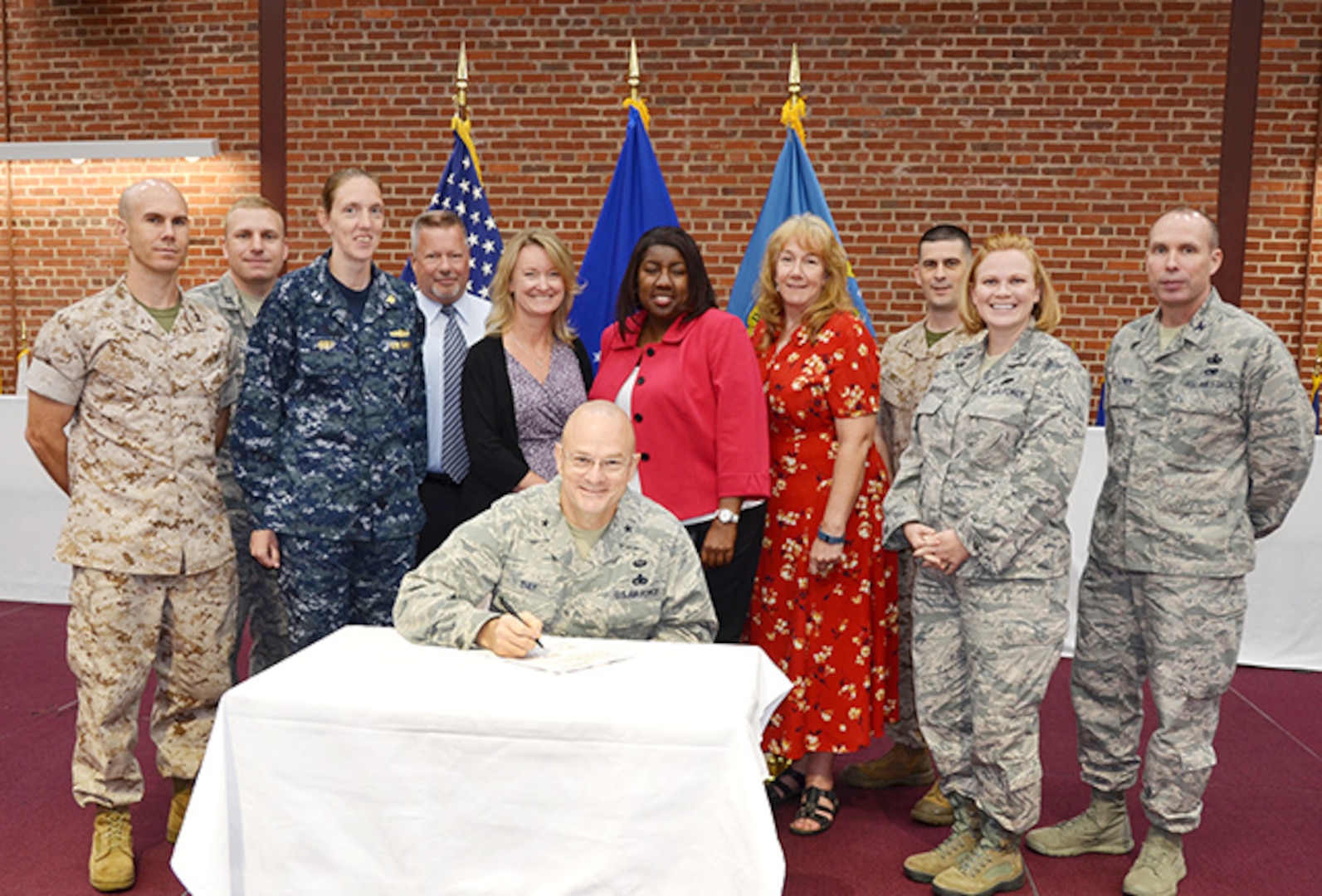 Defense Logistics Agency Aviation Commander Air Force Brig, Gen. Allan Day signs the DLA Aviation Process Excellence policy June 14, 2016 at Defense Supply Center Richmond, Virginia.