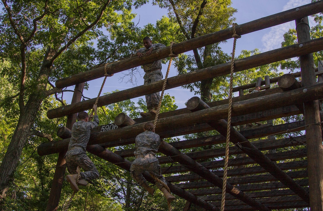 An Army Reserve instructor, attached to Task Force Wolf, monitors cadet leadership course candidates on the confidence course during Cadet Summer Training at the U.S. Army Cadet Command, Ft. Knox, Ky., June 11. (U.S. Army Reserve photo by Sgt. Karen Sampson/ Released)