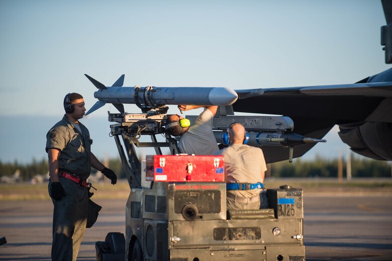U.S. Air Force aircraft armament systems technicians from the 354th Maintenance Squadron load an ** while working the swing shift on an F-16 Fighting Falcon fighter aircraft to be flown by pilots from the 18th Aggressor Squadron (AGRS), June 14, 2016, during RED FLAG-Alaska (RF-A) 16-2 at Eielson Air Force Base, Alaska. The 18th AGRS supports RF-A by sharing its knowledge of flying to participating units and ensuring the U.S. and its allies receive the best air combat training possible. (U.S. Air Force photo by Staff Sgt. Shawn Nickel/Released)
