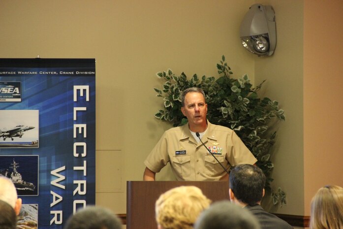 CRANE, Ind. - 160510-N-QI541-014 - CAPT JT Elder provides welcome remarks for the Eighth Annual Electronic Warfare (EW) Capability Gaps and Enabling Technologies Operational and Technical Information Exchange conference co-hosted by The Association of Old Crows (AOC) and Naval Surface Warfare Center Crane (NSWC Crane) at Navy Support Activity (NSA) Crane’s Club Lakeview.