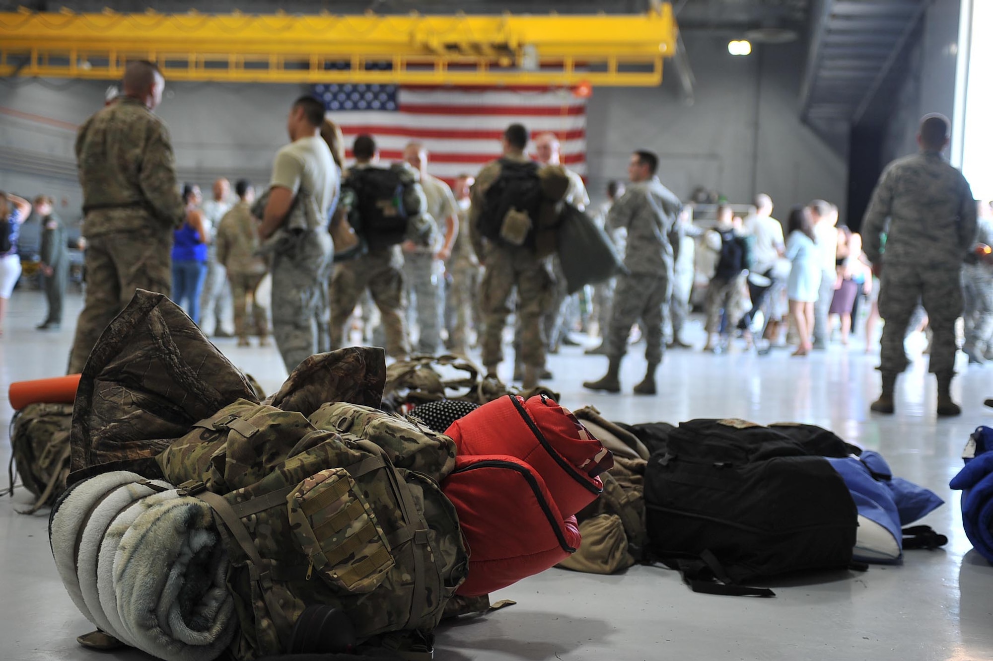 Bags rest on the 823rd Maintenance Squadron hangar floor at Nellis Air Force Base, Nev. Jun 7. Airmen from the 823rd MXG and 66th RQS spent the last four months in Afghanistan providing personnel recovery support. (U.S. Air Force photo by Senior Airman Rachel Loftis)