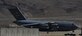 A C-17 carrying Airmen from the 66th Rescue Squadron and 823rd Maintenance Squadron returning home from deployment taxis down the runway at Nellis Air Force Base, Nev., June 7. The Airmen were bused from the Nellis AFB flightline to the 823rd MXS hangar where their families awaited their arrival. (U.S. Air Force photo by Airman 1st Class Kevin Tanenbaum)