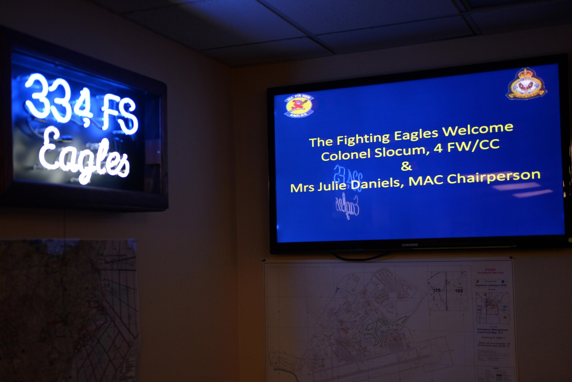 Col. Mark Slocum, 4th Fighter Wing commander, and the 334th Fighter Squadron, welcome Julie Daniels, Military Affairs Committee chairperson, June 14, 2016, at Seymour Johnson Air Force Base, North Carolina. Daniels was invited to take a familiarization flight with Slocum in an F-15E Strike Eagle. (U.S. Air Force photo by Airman 1st Class Ashley Williamson/Released)