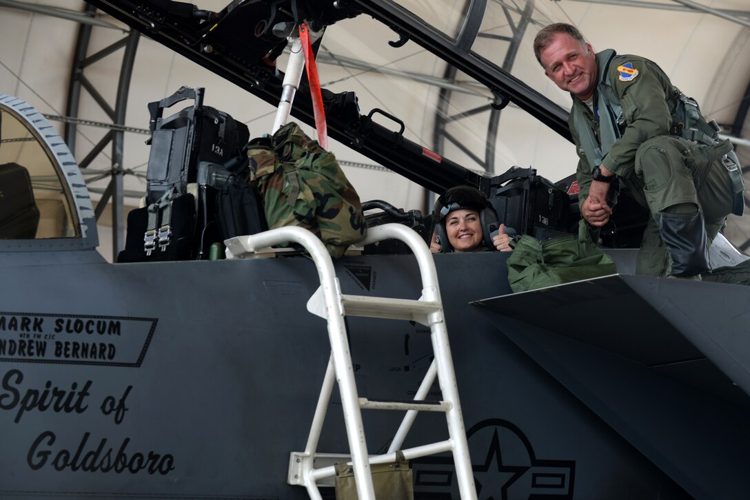 Julie Daniels (left), Military Affairs Committee chairperson, and Col. Mark Slocum (right), 4th Fighter Wing commander, prepare to take off in an F-15E Strike Eagle, June 14, 2016, at Seymour Johnson Air Force Base, North Carolina. As an honorary commander of Seymour Johnson AFB, Daniels was invited to fly with Slocum to familiarize herself with the F-15E capabilities. (U.S. Air Force photo by Airman 1st Class Ashley Williamson/Released)