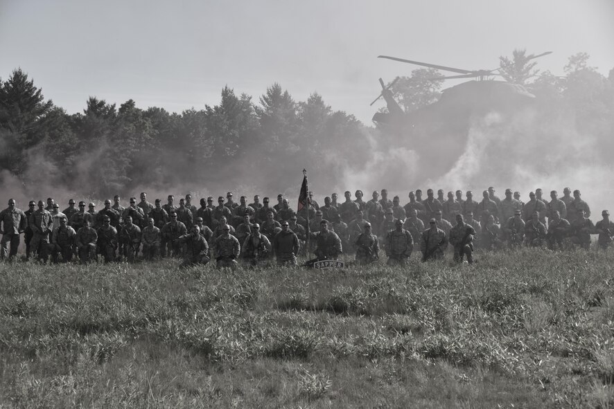 Joint service group photo 911th Security Forces Squadron and 911th Aeromedical Staging Squadron members pose alongside Army National Guardsman before a joint training exercise at Camp Dawson, West Virginia. The 119th Engineer Company (Sapper), West Virginia Army National Guard out of Moundsville, West Virginia, conducted a training exercise that involved the 911th Airlift Wing members, as well as, the Army National Guard units, the 753rd Ordnance Company and the 150th Aviation Regiment. (U.S. Air Force photo by Staff Sgt. Jonathan Hehnly)