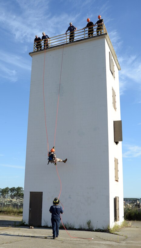 A Marine Corps Junior Reserve Officers Training Corps cadet from Plaquemine High School, Plaquemine, La., rappels down a tower during a Cadet Leadership Camp aboard Marine Corps Logistics Base Albany, June 8.