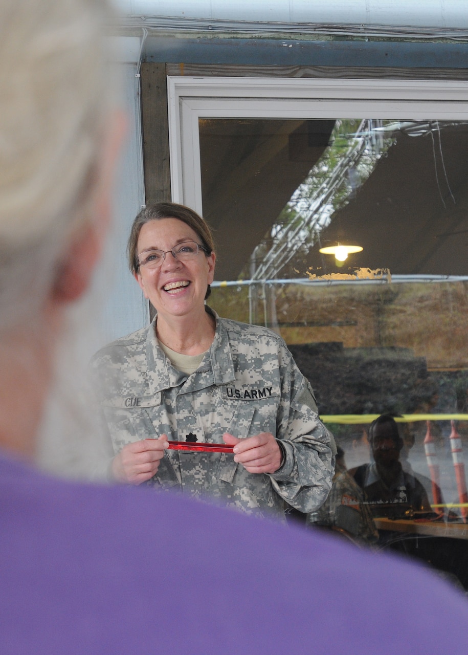Army Lt. Col. Patricia I Cue, 1984th U.S. Army Hospital Pacific, 9th Mission Support Command, demonstrates blood viscosity changes during a nutrition class as part of Tropic Care 2016 at Hawaii Ocean View Estates, Hawaii, June 1, 2016. Blood viscosity -- influenced by diet, weight and health conditions such as diabetes -- affects how efficiently blood is able to flow throughout the body. Army photo by Sgt. Rachel S. Grothe