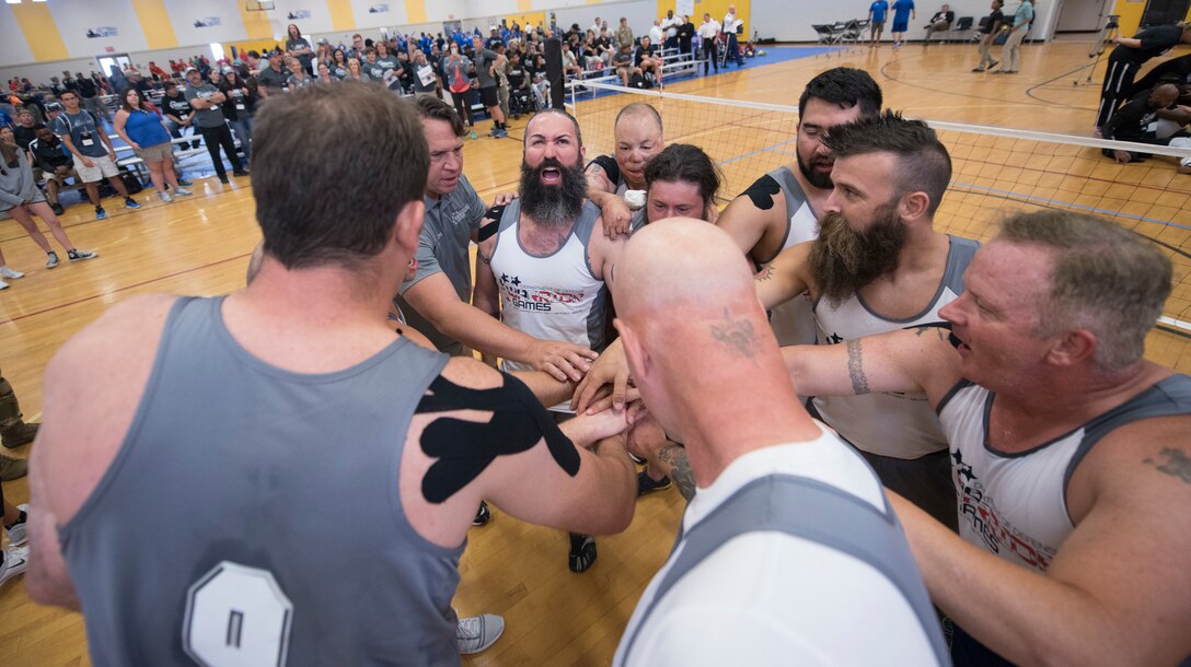U.S. Special Operations Command athletes celebrate after beating Team Army in sitting volleyball during the 2016 Department of Defense Warrior Games at the U.S. Military Academy in West Point, N.Y., June 15, 2016. DoD photo by Roger Wollenberg