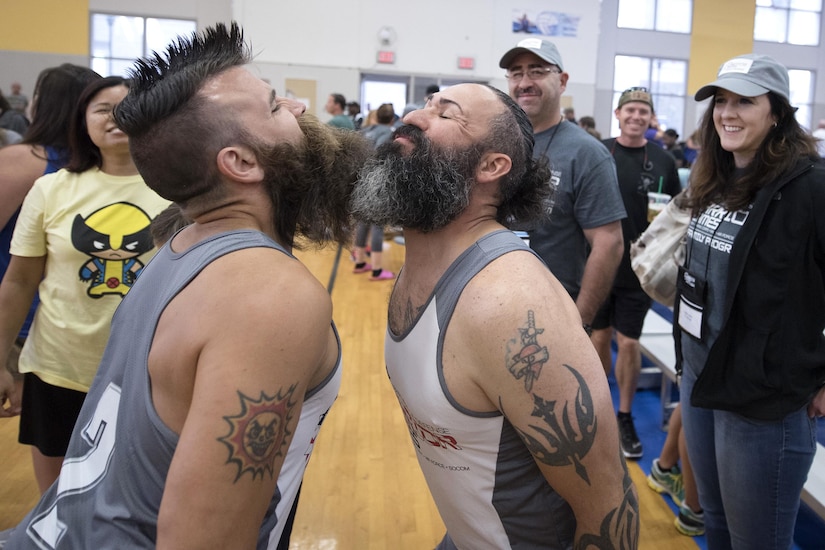 Veterans Fred Lewis, left, and Victor Sassoon, members of the U.S. Special Operations Command team, bump beards for good luck after beating Team Army in sitting volleyball during the 2016 Department of Defense Warrior Games at the U.S. Military Academy in West Point, N.Y., June 15, 2016. DoD photo by Roger Wollenberg