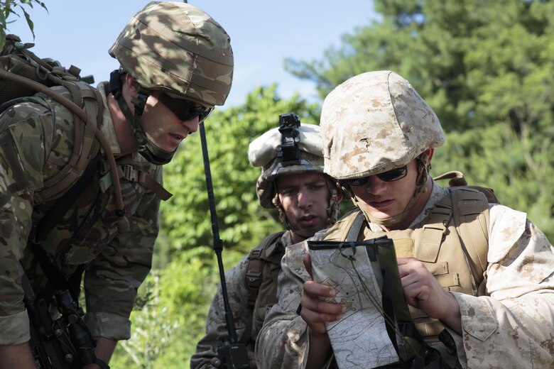 Members from an integrated platoon of Marines with Company C, 6th Engineer Support Battalion, 4th Marine Logistics Group, Marine Forces Reserve, and commandos with 131 Commando Squadron Royal Engineers, British army, navigate back to their forward operating base after conducting a bridge reconnaissance mission during exercise Red Dagger at Fort Indiantown Gap, Penn., June 13, 2016. Exercise Red Dagger is a bilateral training exercise that gives Marines an opportunity to exchange tactics, techniques and procedures as well as build working relationships with their British counterparts. (U.S. Marine Corps photo by Sgt. Ian Leones/Released)