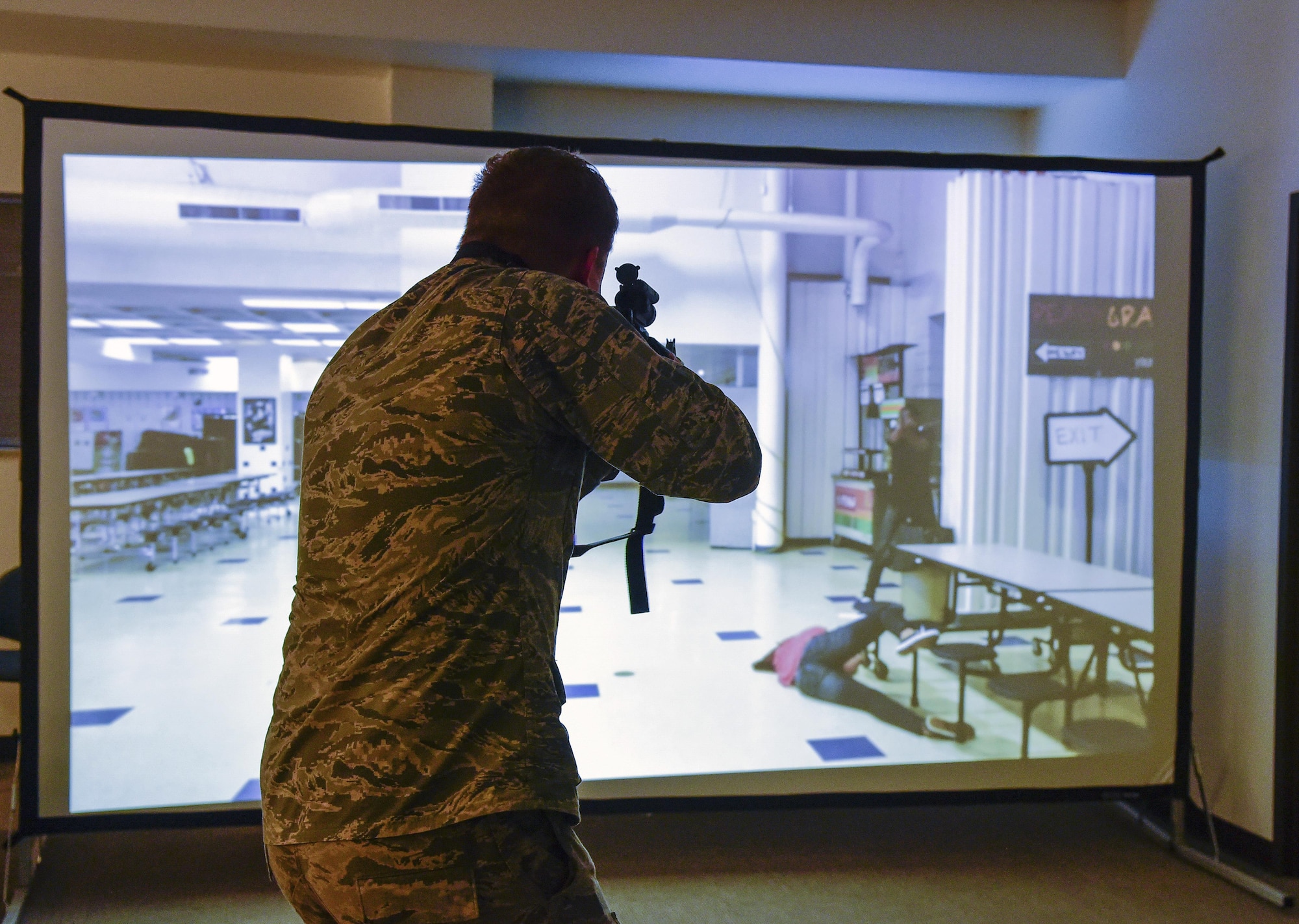 Cadet Alex Korskey, U.S. Air Force Academy, engages in an exercise active shooter scenario hosted by the 460th Security Forces Squadron during a mission briefing June 15, 2016, at Buckley Air Force Base, Colo. The cadets toured Buckley’s units and missions, while engaging with leaders of all ranks in order to gain a better understanding of an operational air force base. (U.S. Air Force photo by Tech. Sgt. Nicholas Rau)