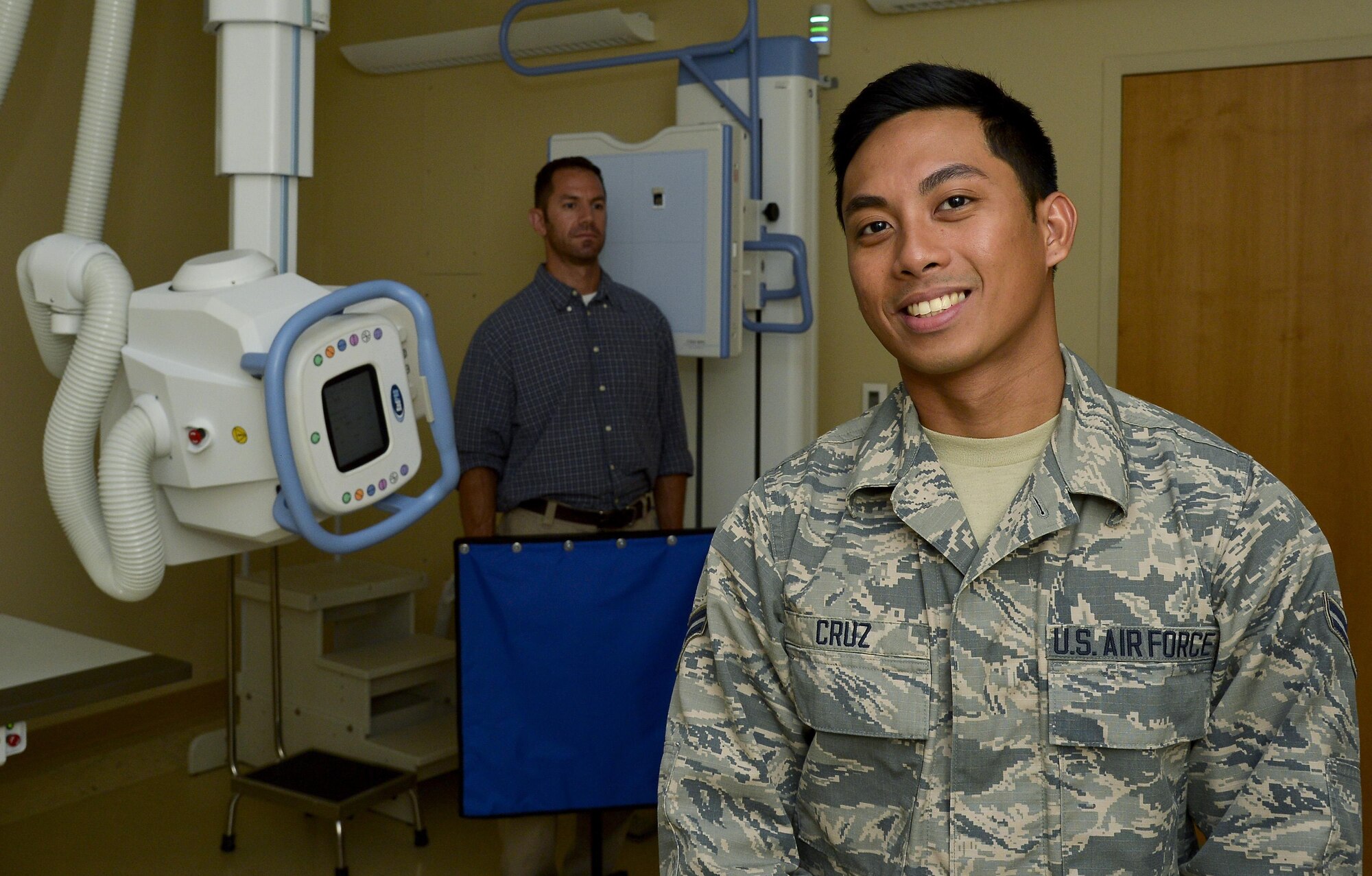 Airman 1st Class Mark Cruz, a Phase II Radiology student assigned to the 6th Medical Support Squadron, and Jeffrey Marchaesi, the Phase II Course supervisor, recount Cruz’s journey of becoming an American citizen at MacDill Air Force Base, Fla., June 15, 2016. Cruz was born in the Bulacan province of the Philippines and recently completed the naturalization process while attending training at MacDill. (U.S. Air Force photo by Staff Sgt. Shandresha Mitchell)