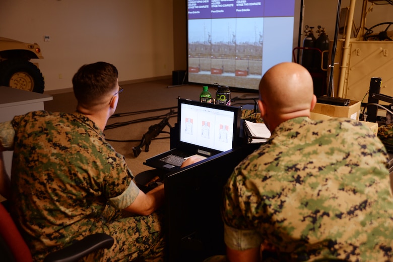 Marine Corps Logistics Base Albany marksmanship instructors use the Indoor Simulated Marksmanship Trainer to help shooters familiarize themselves with weapons before qualifying on the pistol or rifle range, recently.