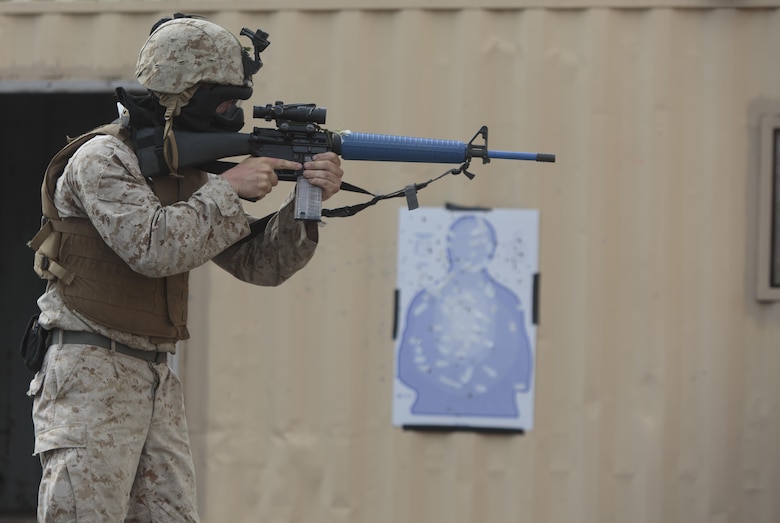 Sgt. Justin A. Potts, a platoon sergeant with Company C, 6th Engineer Support Battalion, 4th Marine Logistics Group, Marine Forces Reserve, fires 9mm Simunition rounds at a target in preparation for an urban assault training event during exercise Red Dagger at Fort Indiantown Gap, Penn., June 13, 2016. Exercise Red Dagger is a bilateral training exercise that gives Marines an opportunity to exchange tactics, techniques and procedures as well as build working relationships with their British counterparts. (U.S. Marine Corps photo by Sgt. Ian Leones/Released)