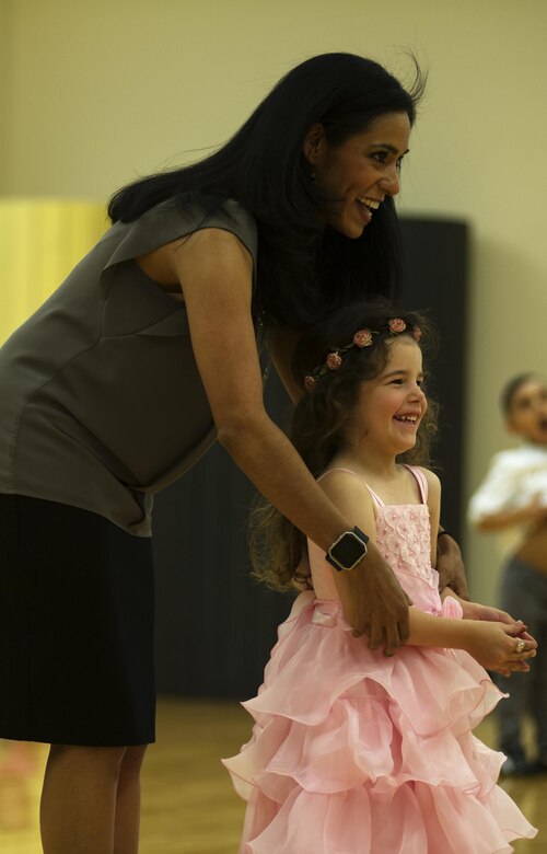 Adriana Bruton, a dance instructor and military spouse, dances with a student June 1, 2016, at Fairchild Air Force Base, Wash. During the children’s dance classes, Bruton teaches more than just dancing. Students also work on their self-confidence and socialization skills by introducing themselves to people and talking about their passions. (U.S. Air Force photo/Airman 1st Class Sean Campbell)