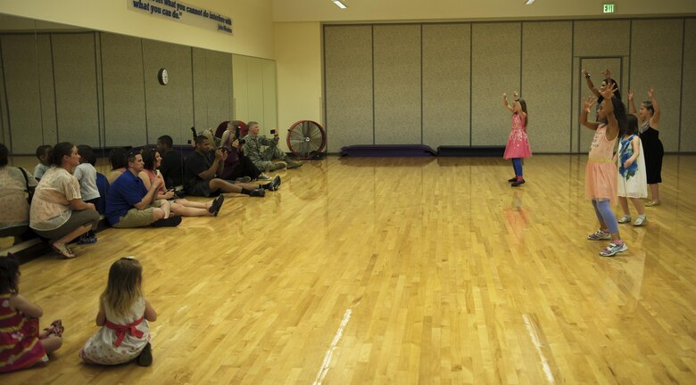 Adriana Bruton, a dance instructor and military spouse, dances with a student June 1, 2016, at Fairchild Air Force Base, Wash. During the children’s dance classes, Bruton teaches more than just dancing. Students also work on their self-confidence and socialization skills by introducing themselves to people and talking about their passions. (U.S. Air Force photo/Airman 1st Class Sean Campbell)