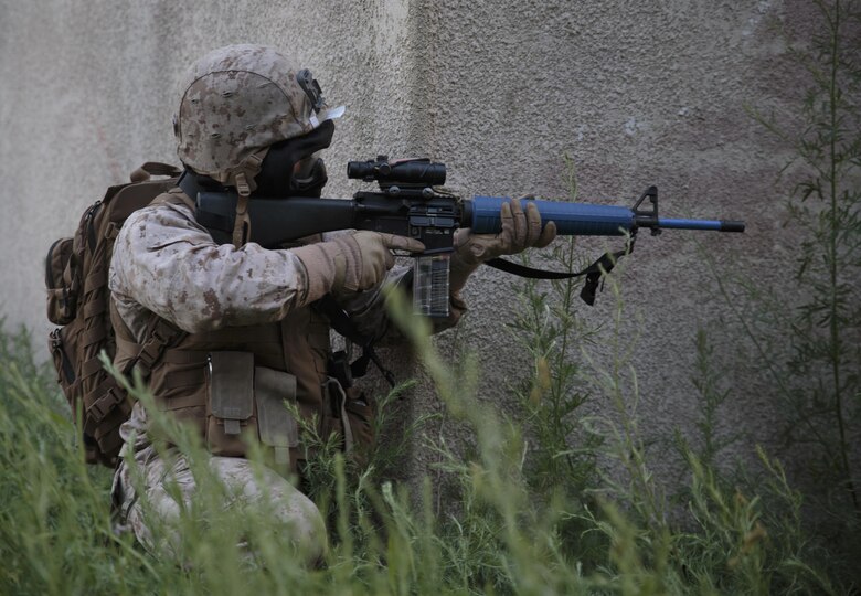 Sgt. Nicholas A. Skaggs, a platoon sergeant with Company C, 6th Engineer Support Battalion, 4th Marine Logistics Group, Marine Forces Reserve, provides security on a building during a simulated raid on an urban compound during exercise Red Dagger at Fort Indiantown Gap, Penn., June 13, 2016. Exercise Red Dagger is a bilateral training exercise that gives Marines an opportunity to exchange tactics, techniques and procedures as well as build working relationships with their British counterparts. (U.S. Marine Corps photo by Sgt. Ian Leones/Released)