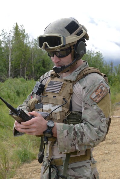 U.S. Air Force Staff Sgt. Stephan Mynatt II, a joint tactical air controller (JTAC) assigned to the 13th Air Support Operations Squadron, Fort Carson, Colo., receives a radio call during RED FLAG-Alaska (RF-A) 16-3, June 13, 2016, at the Joint Pacific Alaska Range Complex, Alaska. A JTAC’s job is to point close-air support to its target, assisting ground troops in accomplishing their mission safely. (U.S. Air Force photo by Staff Sgt. Ashley Nicole Taylor/Released)