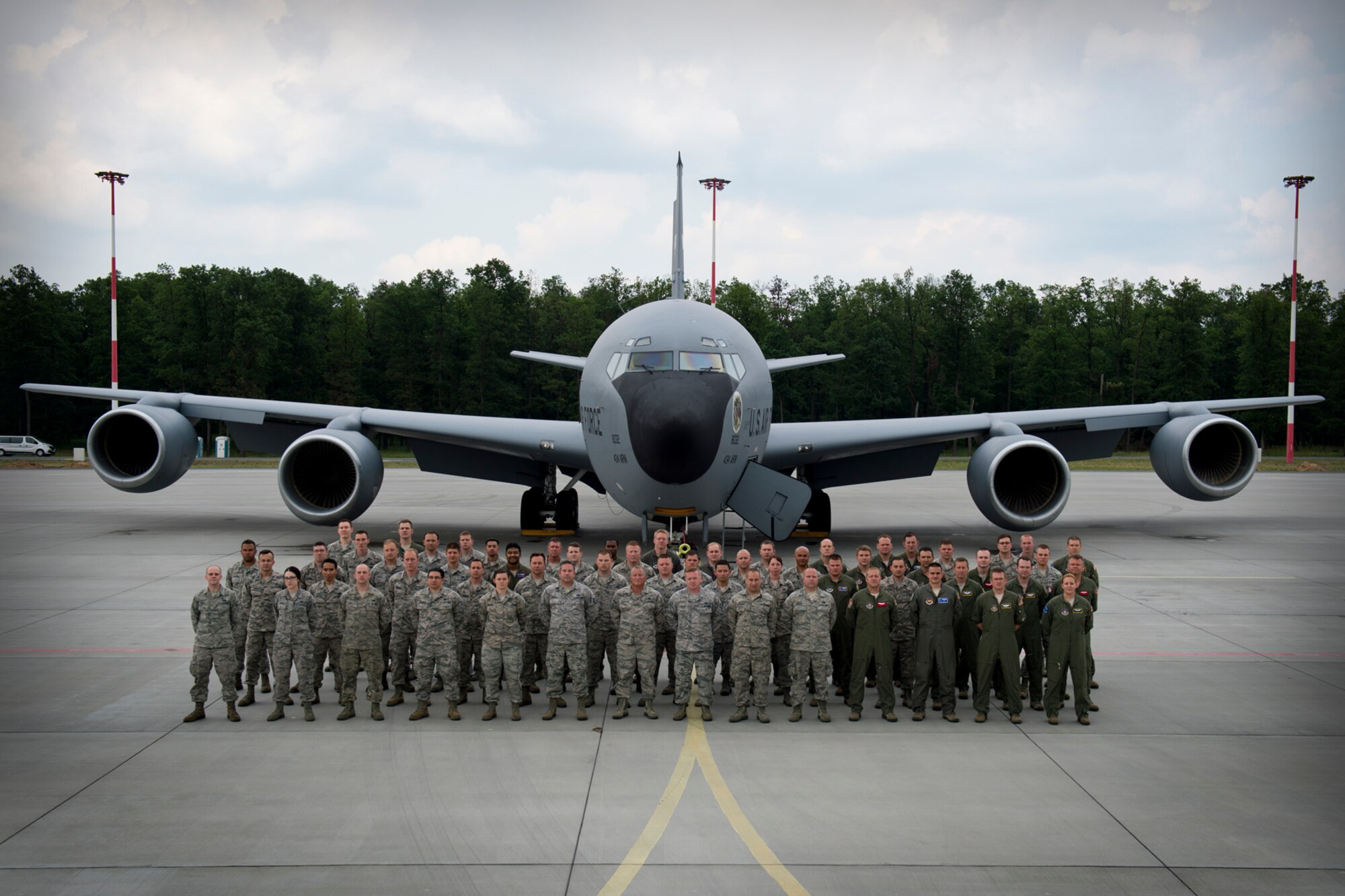 Aircrew, boom operators, maintenance and support Airmen from the 100th and 434th Air Refueling wings at Royal Air Force Mildenhall, England, and Grissom Air Reserve Base, Ind., stand in formation in front of a KC-135 Stratotanker from the 434th ARW before wrapping up Baltic Operations 2016, June 15, 2016, at Powidz Air Base, Poland. The KC-135s flew 30 sorties; 95 flying hours off-loading 953 pounds of JP8 fuel to U.S. jets and Polish F-16s, totaling 93 receivers, 27 of which were Polish. (U.S. Air Force photo/Senior Airman Erin Babis)