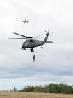U.S. Air Force pararescuemen with the 210th Rescue Squadron out of Eielson Air Force Base, Alaska, perform a combat search and rescue demonstration June 13, 2016, in the Joint Pacific Alaska Range Complex as an A-10 Thunderbolt II with the 354th Fighter Squadron from Davis-Monthan Air Force Base, Ariz., passes by during RED FLAG-Alaska 16-2. The demonstration was for the Executive Observer Program, which presents U.S. Pacific Air Forces’ premier multinational large force employment exercise while building partnerships with senior airpower leaders from the global community. (U.S. Air Force photo by Staff Sgt. Ashley Nicole Taylor/Released)