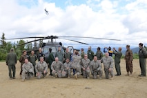 After experiencing show of force demonstrations that highlighted combat capabilities offered to nations participating in RED FLAG-Alaska (RF-A) exercises, senior leaders from the global community stand together for a group photo in front of RF-A 16-2 participating fighter jets June 13, 2016, at Eielson Air Force Base, Alaska. Leaders spent a total of four days together at Joint Base Elmendorf-Richardson and Eielson strengthening foreign relations and showcasing the joint environment unmatched by other exercises. (U.S. Air Force photo by Staff Sgt. Ashley Nicole Taylor/Released)