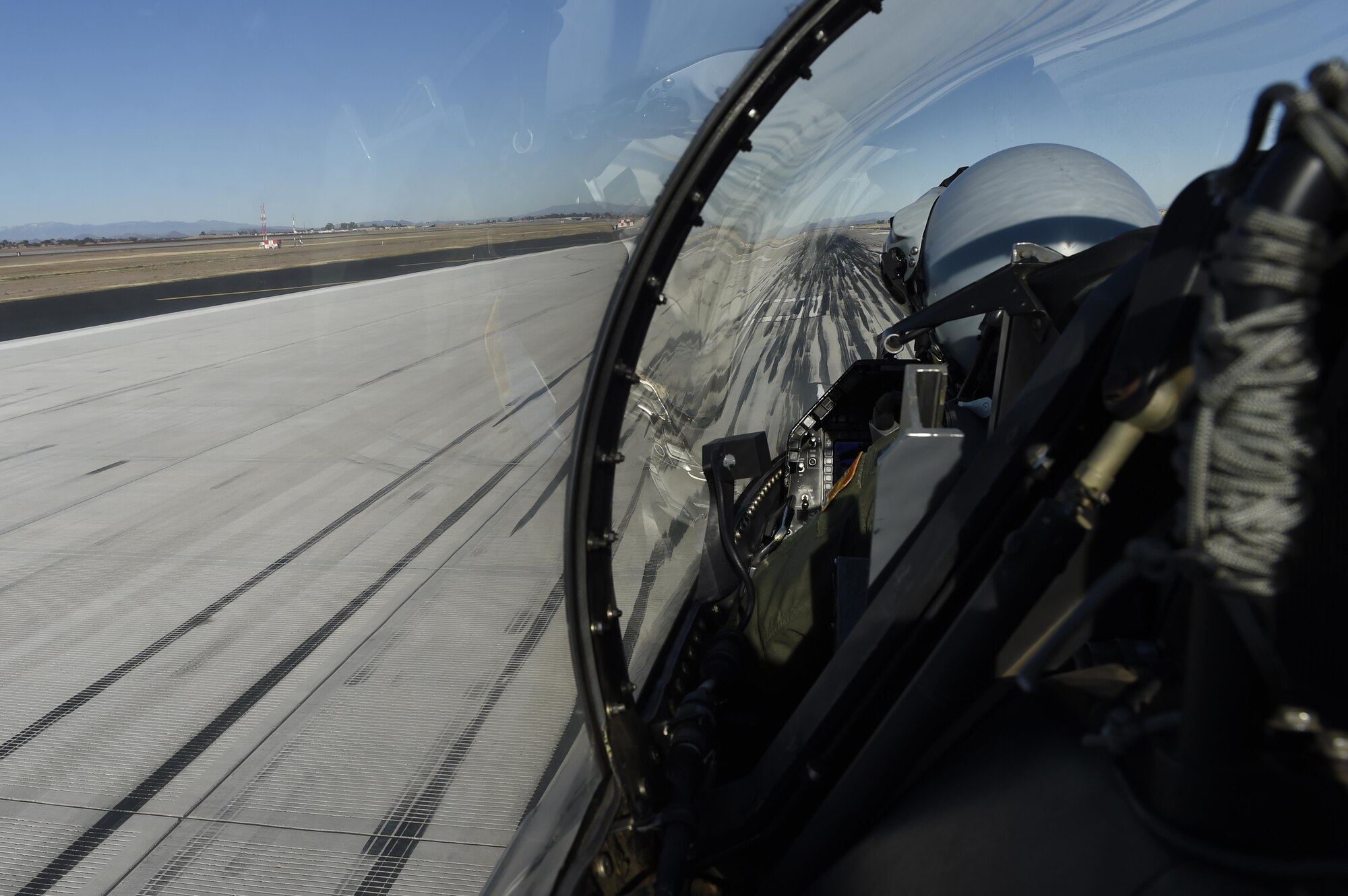 An F-16 Fighting Falcon taxis over an area of the flightline with rubber deposits at Luke Air Force Base, Ariz. Every time an aircraft lands, it deposits thin layers of rubber on the runway. Over time the rubber builds up and poses a risk to landing aircraft, especially in wet conditions. (U.S. Air Force photo by Staff Sgt. Staci Miller)
