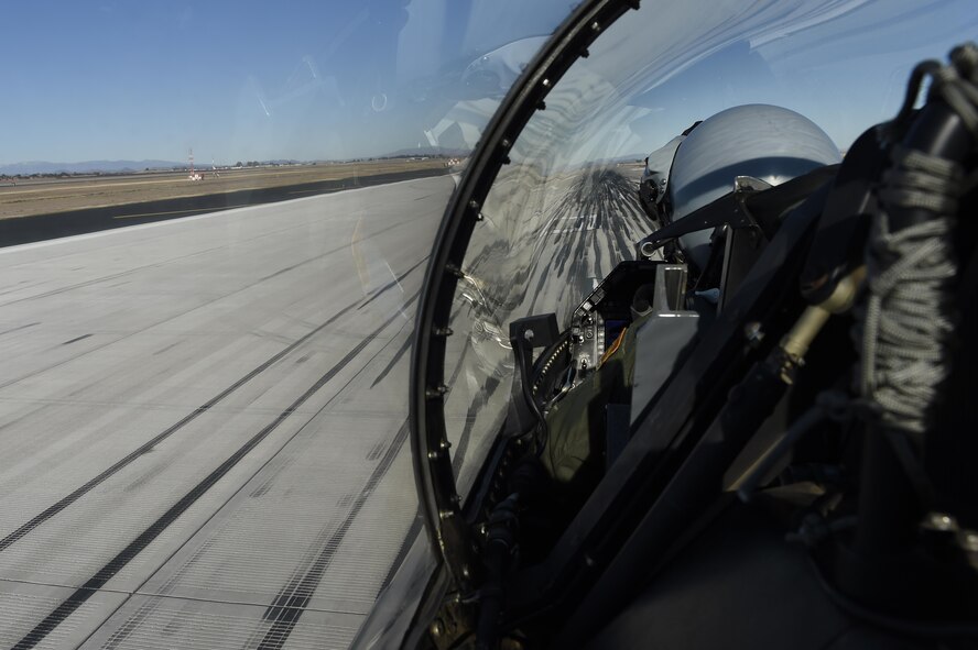 An F-16 Fighting Falcon taxis over an area of the flightline with rubber deposits at Luke Air Force Base, Ariz. Every time an aircraft lands, it deposits thin layers of rubber on the runway. Over time the rubber builds up and poses a risk to landing aircraft, especially in wet conditions. (U.S. Air Force photo by Staff Sgt. Staci Miller)
