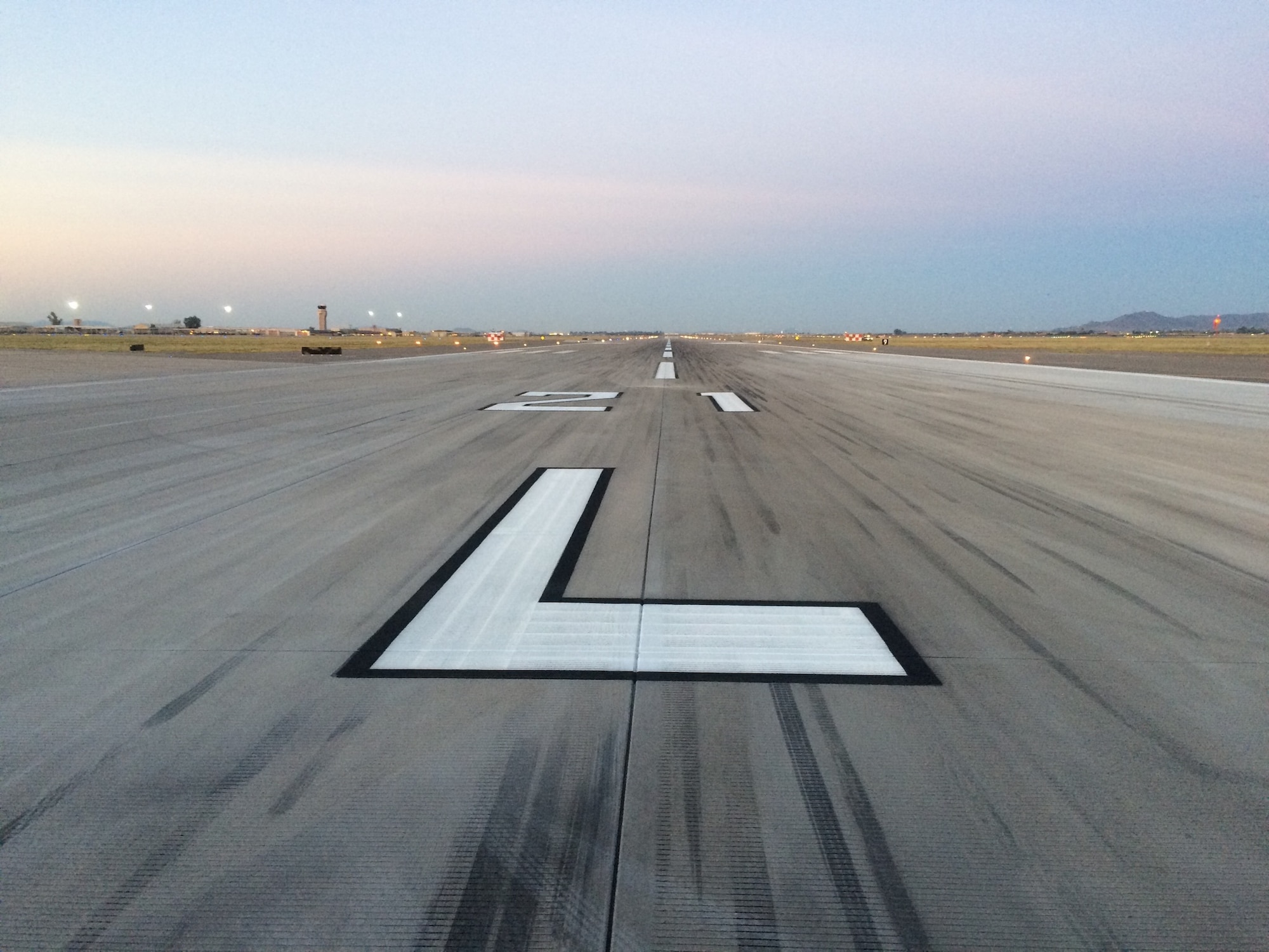 This is the Luke Air Force Base, Ariz., runway after receiving rubber removal treatment, May 2016. Every time an aircraft lands, it deposits thin layers of rubber on the runway. Over time the rubber builds up and poses a risk to landing aircraft, especially in wet conditions. (Courtesy photo)
