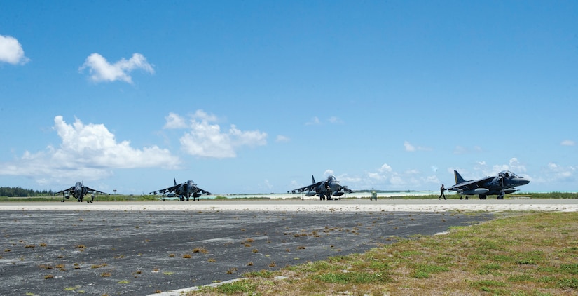 U.S. Marine Corps AV-8B Harriers from VMA-542 rest on the tarmac after landing at Wake Island Airfield in the mid-Pacific. Marine Attack Squadron 542 is based at Marine Corps Air Station Cherry Point, North Carolina. The Marines were participating in a trans-Pacific mission from the mainland U.S. to Japan. Joint Base Elmendorf-Richardson and Eielson Air Force Base personnel support the tiny detachment on Wake. (U.S. Air Force photo/1st Lt. Michael Trent Harrington)