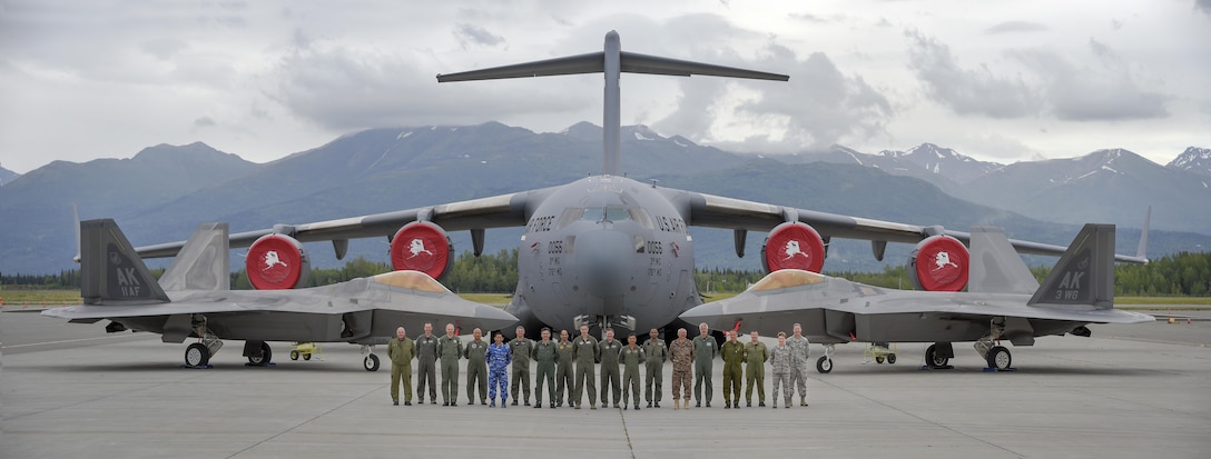 Senior air leaders, from Bangladesh, Canada, Finland, Germany, Indonesia, Japan, Mongolia, New Zealand, the Philippines, Sri Lanka, Sweden, Thailand and the U.S. stand for a group photograph at Joint Base Elmendorf-Richardson, Alaska, during RED FLAG-Alaska16-2, as part of the Executive Observer Program at Joint Base Elmendorf-Richardson, Alaska, June 10, 2016. The international air leaders were on JBER to observe RF-A, a series of Pacific Air Forces commander-directed training exercises for U.S. and international forces to provide joint offensive, counter-air, interdiction, close air support, and large force employment in a simulated combat environment. (U.S. Air Force photo illustration by Alejandro Pena/Released)