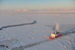 The Kigluaik Mountains are visible as the Coast Guard Cutter Healy breaks ice for the Russian tanker Renda near Nome Jan. 13, 2012. The Healy and crew are approximately seven nautical miles away from Nome. (U.S. Coast Guard photo by Petty Officer 2nd Class Charly Hengen/Released)