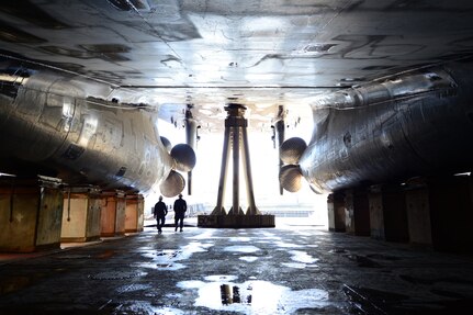 Chief Petty Officer Mark Wanjongkhum and Chief Warrant Officer Michael Allen, both from Surface Forces Logistics Center, walk around the U.S. Coast Guard Cutter Healy while in dry dock at Vigor Shipyard in Seattle, March 31, 2016. Healy will return to the water this week after three months of maintainance.  U.S. Coast Guard photo by Petty Officer 1st Class Zac Crawford.