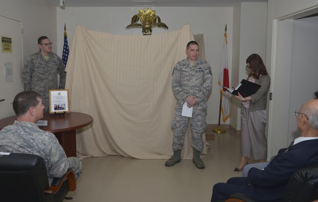 Master Sgt. Jacob Meyer, 374th Maintenance Squadron aerospace ground equipment flight assistant flight chief, gives a speech during the mikoshi rededication ceremony at Yokota Air Base, Japan, June 15, 2016. The flight worked more than 150 hours sanding, stripping, painting and treating the wooden surfaces as well as trimming, shaping and fitting over 10 square meters of brass to replace the ornate work over the course of one month. (U.S. Air Force photo by Senior Airman David Owsianka/Released)