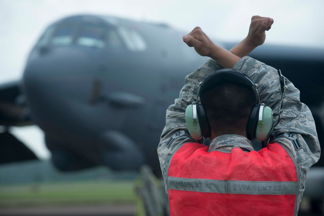 Airman 1st Class Aaron Sampayan, 5th Expeditionary Aircraft Maintenance Squadron assistant dedicated crew chief, taxis a B-52H Stratofortress at RAF Fairford, United Kingdom, after its first Saber Strike mission June 13, 2016. The exercise demonstrates the ability to bring together forces from multiple nations to train and improve joint allied readiness. (U.S. Air Force photo/Senior Airman Sahara L. Fales)