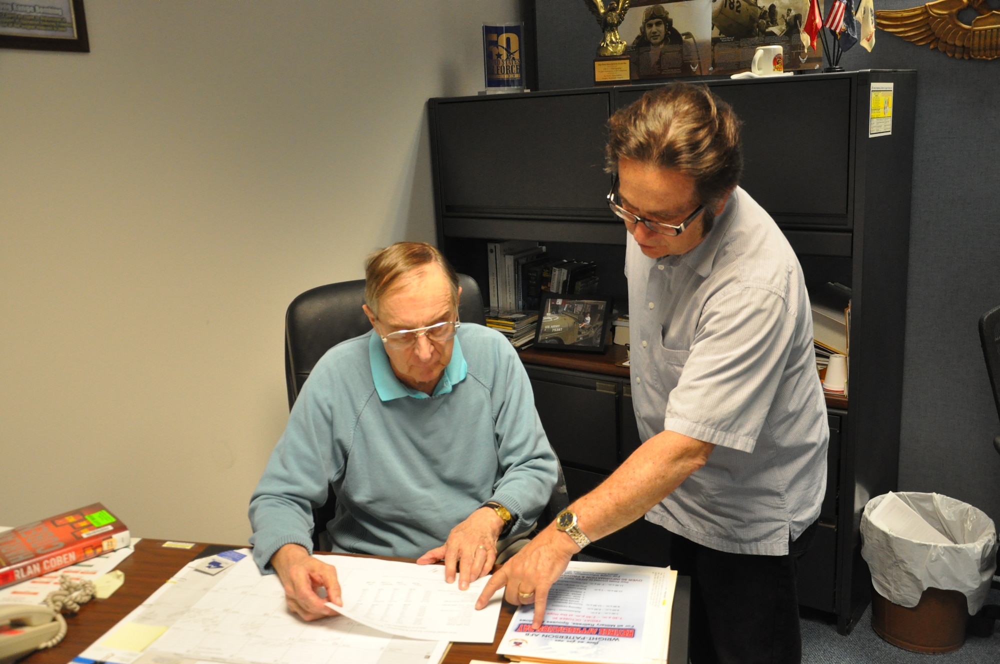 Paul Moore and Rick Tallarigo reviewing Veterans Affairs information