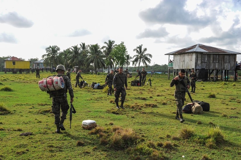 Honduran military members drop off their gear and supplies at their outpost in the Gracias a Dios department of Honduras during the twentieth iteration of Operation CARAVANA, June 9, 2016. During CARAVANA operations, Joint Task Force-Bravo provides the Honduran military with airlift support to give Honduran troops freedom of movement and access to outposts in the Gracias a Dios, Colon and Olancho departments to combat illicit trafficking of drugs, weapons and money. (U.S. Air Force photo by Staff Sgt. Siuta B. Ika)