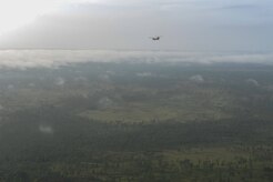 A CH-47 Chinook flown by Joint Task Force-Bravo’s 1st Battalion, 228th Aviation Regiment flies with Honduran troops over the Gracias a Dios department of Honduras during the twentieth iteration of Operation CARAVANA, June 9, 2016. During this iteration of CARAVANA, the 1-228th AVN provided two UH-60 Black Hawks and two CH-47 Chinooks for the troop transport to enable Honduras to conduct Counter-Transnational Organized Crime operations to disrupt and deter Transnational Threat Networks in Central America. (U.S. Air Force photo by Staff Sgt. Siuta B. Ika)